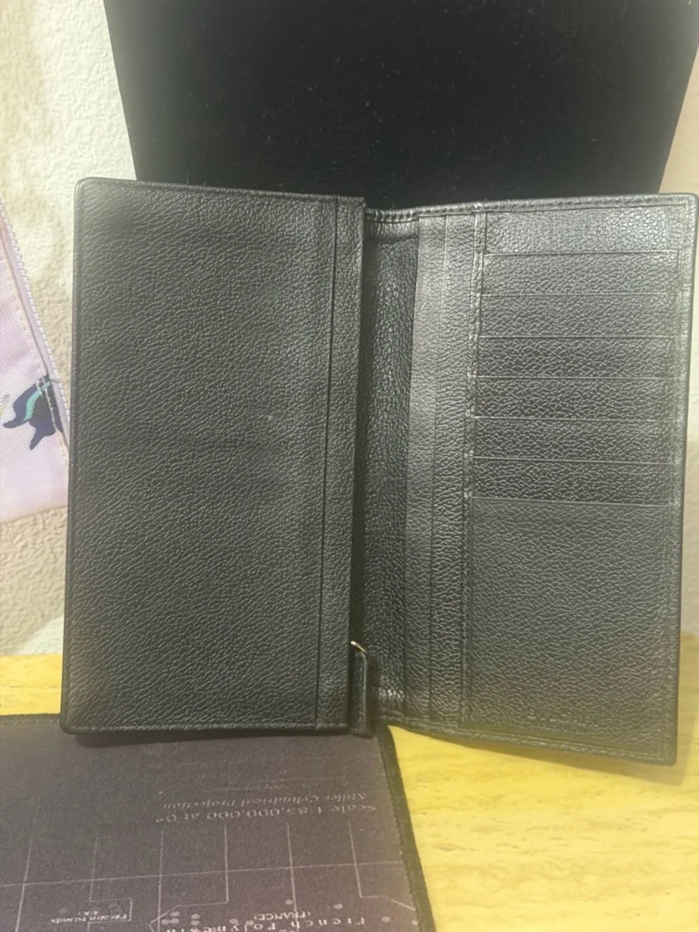 BVLGARI Mille Righe long wallet made from PVC and leather.